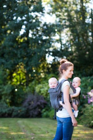 twins in 2 baby carriers