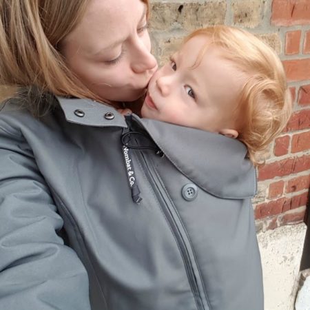 mother with toddler inside wombt babywearing coats