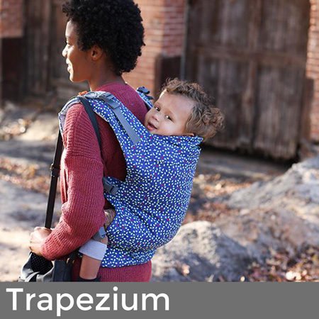 mum carrying happy toddler on her back in beco toddler trapezium