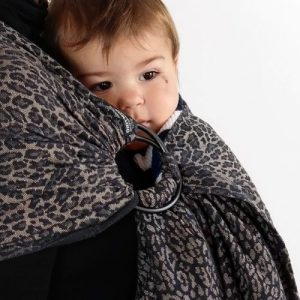 Close up of baby being carried in Didymos DidySling Ring Sling in Leo leopard print