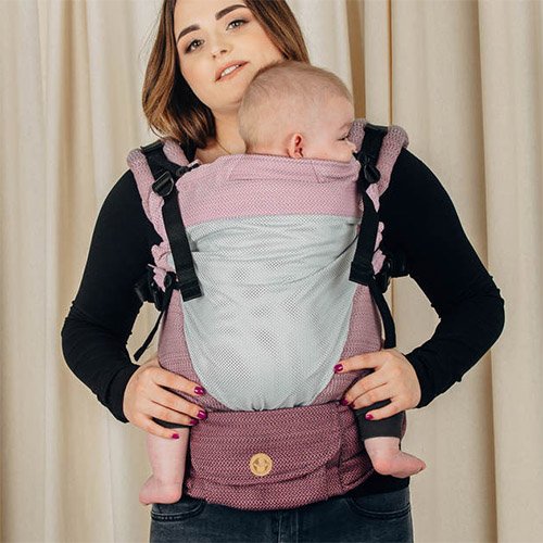 Front view of woman carrying baby facing towards her in Ombre Pink Lenny Lamb LennyUpgrade mesh baby carrier