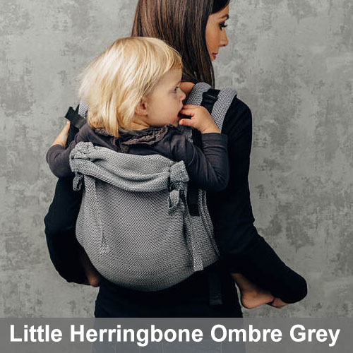Woman carries baby on her back in Lenny Lamb Onbuhimo baby carrier in Little Herringbone Ombre Grey fabric, back view