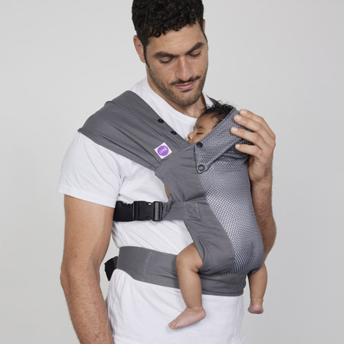 Man carries baby on his chest in Izmi Breeze Baby Carrier