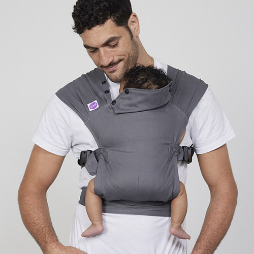 Man carries baby on his chest in Izmi Baby Carrier